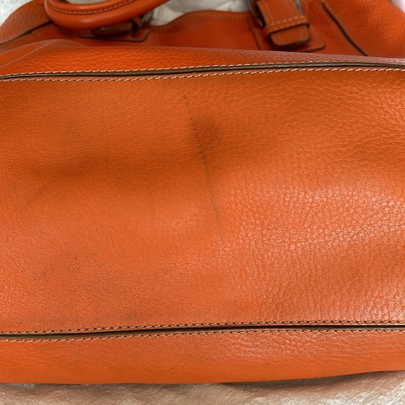 Large leather Cole Haan orange shoulder bag with silver hardware buckles. - Picture 11 of 16